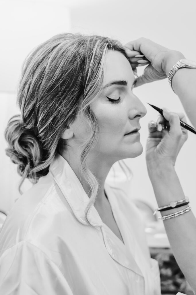 Bride getting final touches of makeup