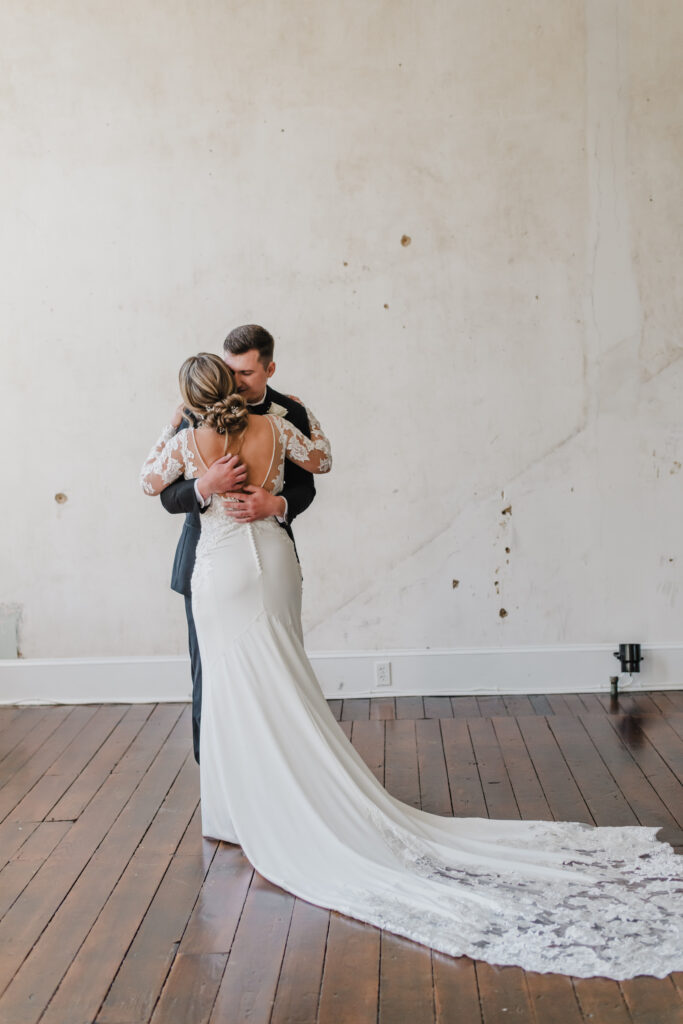bride and groom exchange first look on their wedding day at excelsior in lancaster pennsylvania