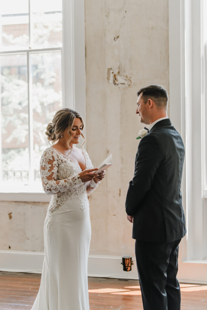bride and groom exchange vows