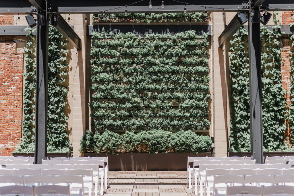 Excelsior wedding venue ceremony space with a green wall